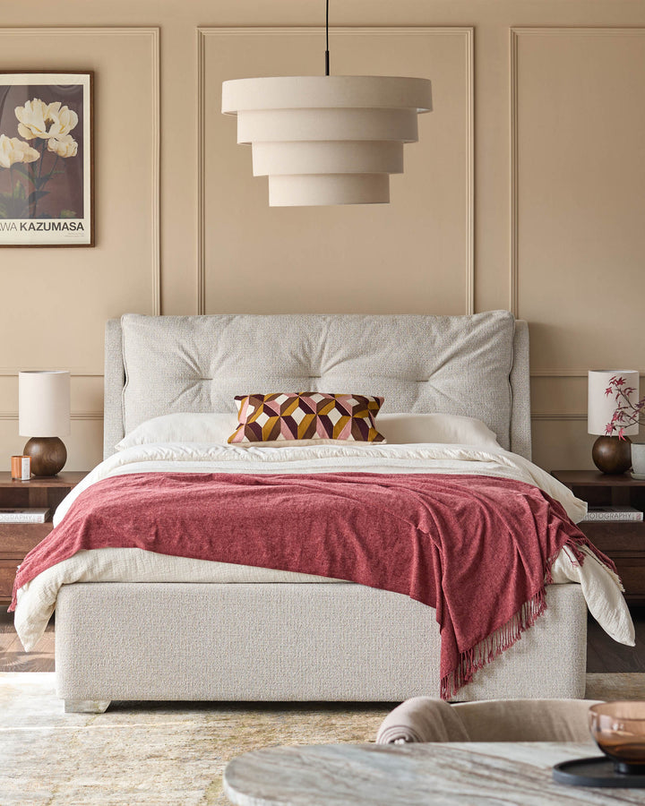 Bedroom features a bed with patterned headboard, side tables, lamps, and a layered pendant light.