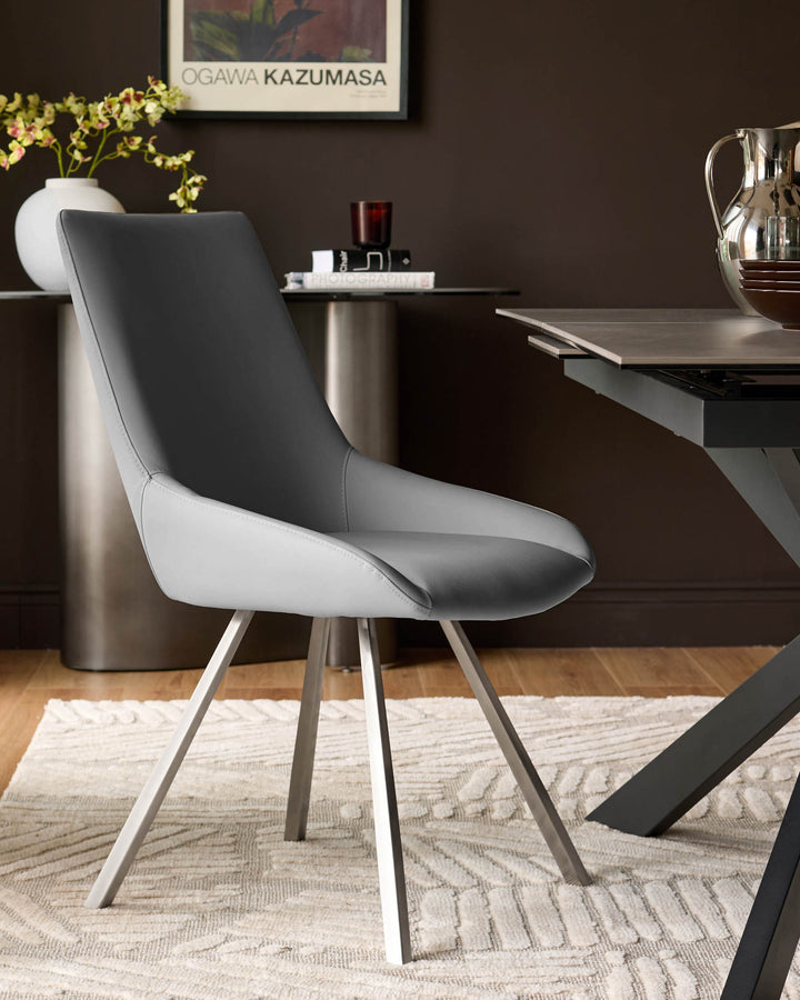 Theo faux leather dining chair in mid-grey and white with tapered metal legs, shown in a styled room setting.