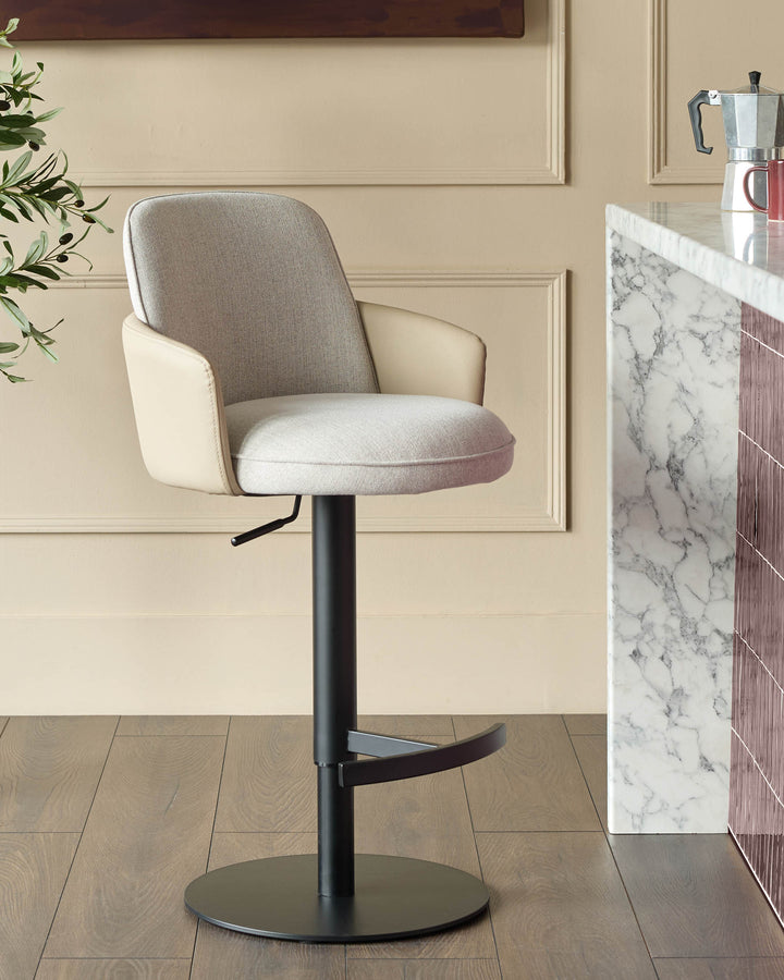 Wren gas lift bar stool in natural fabric with faux leather trim, black base, shown in cream kitchen setting.