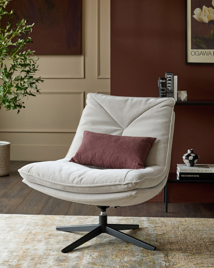 Zia swivel chair in natural grey fabric with burgundy accent pillow, black swivel base, angled front view in styled room setting.