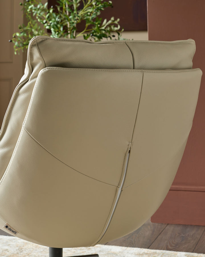 Cream leather swivel chair shown from rear angle, displaying curved backrest with visible seams and quilted cushioning details.