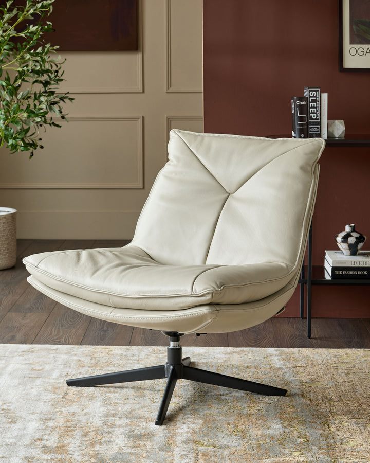 Zia swivel chair in natural grey leather with curved back, positioned at an angle on a black four-star base.