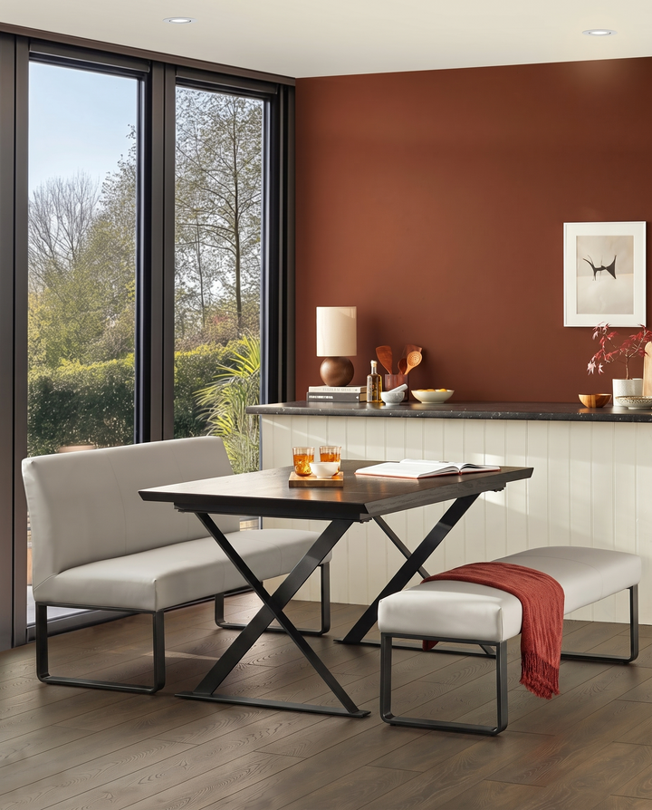 Loop 3-seater bench without backrest, light grey upholstery, black metal legs, shown in dining setting.