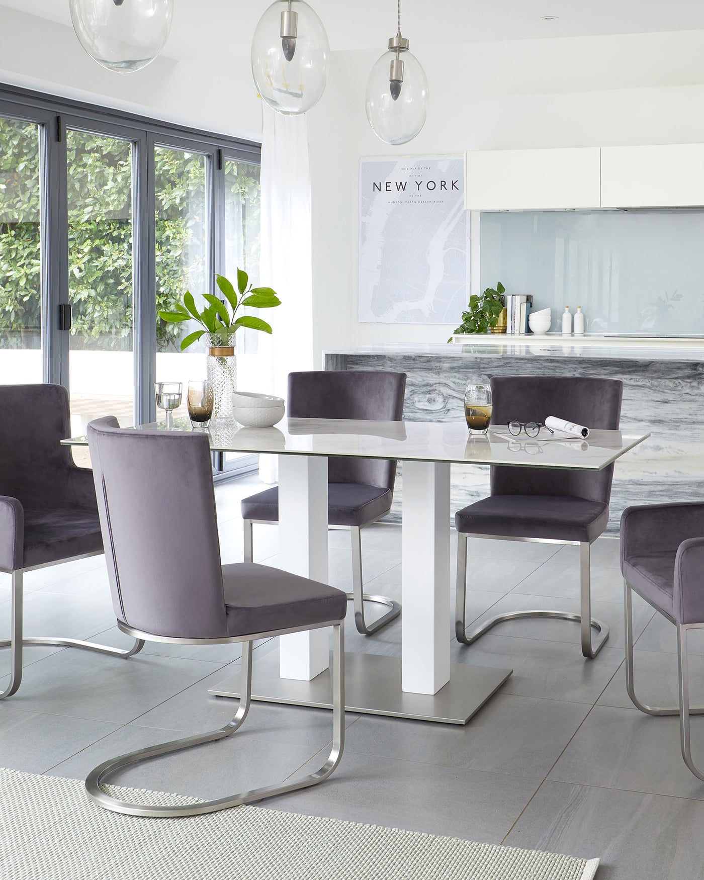 Modern dining room furniture with sleek white dining table featuring a glossy finish and solid rectangular base. Paired with six purple upholstered chairs with unique chrome cantilever frames that provide a floating effect. A stylish and contemporary dining set perfect for an elegant home interior.