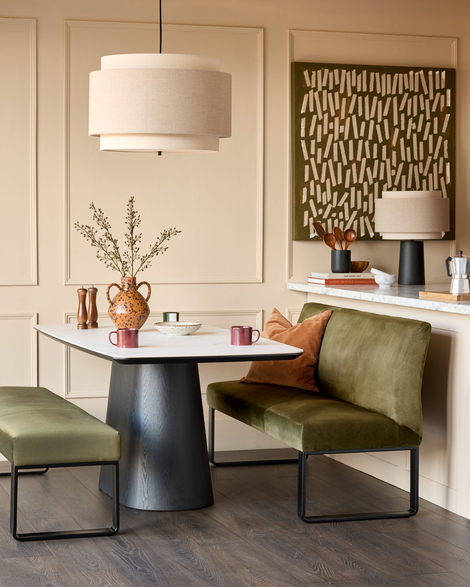Loop 3-seater velvet bench without backrest in olive green with black metal base, shown in modern room setting.