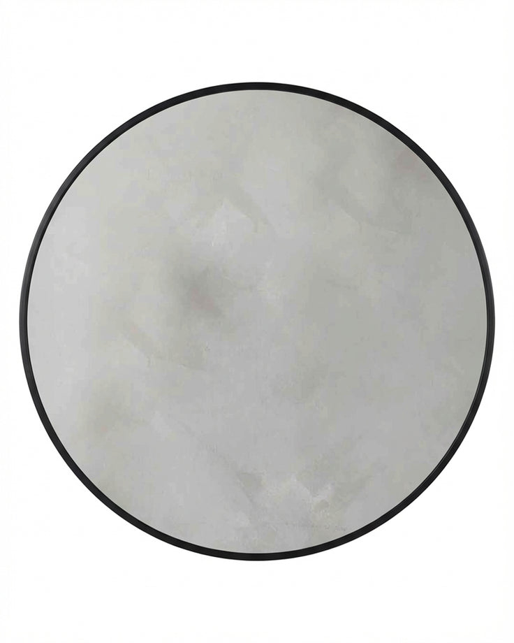Large round wall mirror with black frame and reflective glass surface