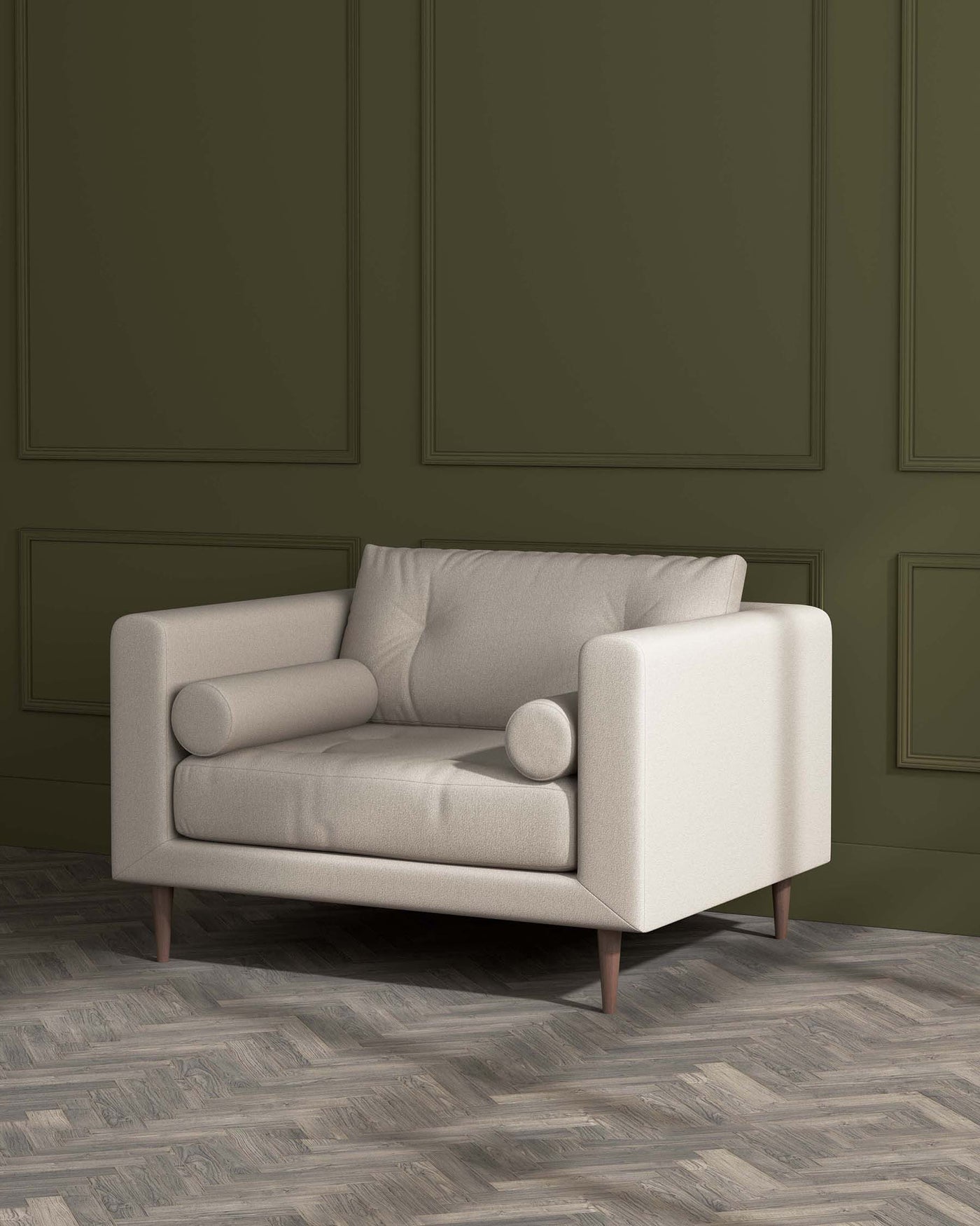 Modern beige fabric loveseat with a minimalist design, featuring clean lines, cushioned arms, and cylindrical cushions, supported by tapered wooden legs, against an olive green panelled wall on a herringbone-patterned wooden floor.