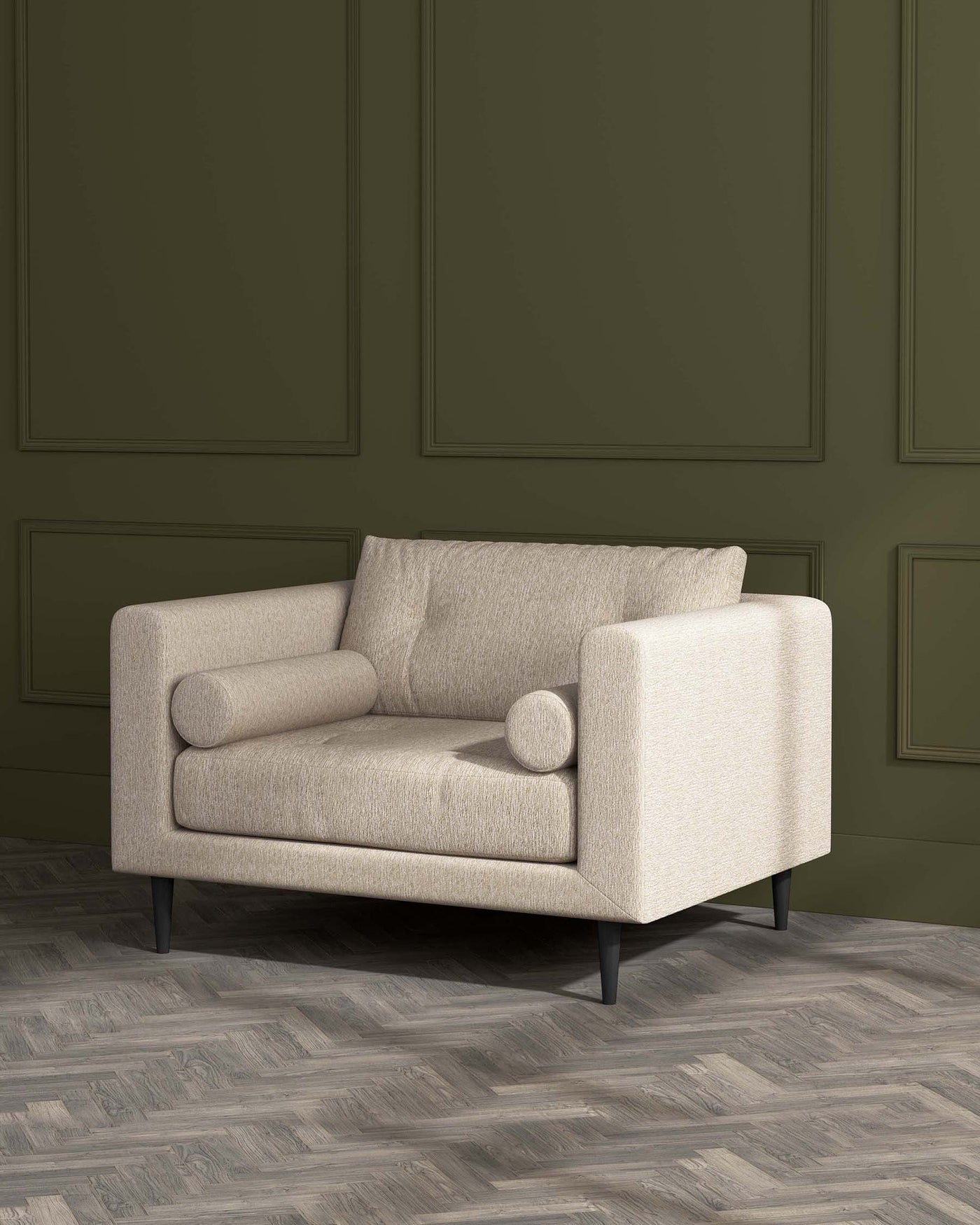 Modern beige two-seater sofa with clean lines and dark wooden legs set against a green panelled wall and herringbone parquet flooring.