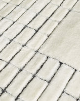 Mosaic cream and black sculpted wool large rug