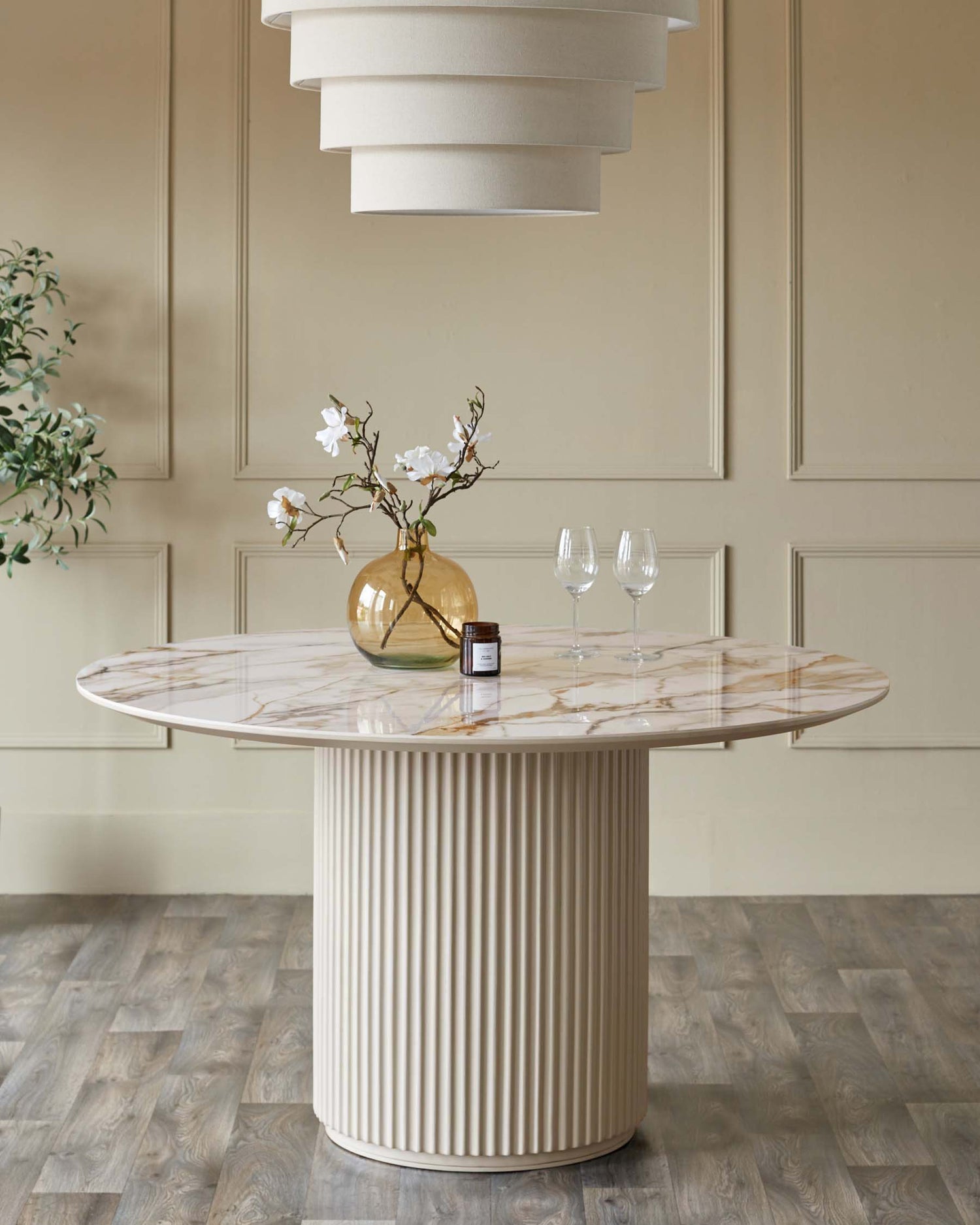 Austin 6-seater dining table with natural ceramic top and white fluted cylindrical base in modern dining room setting.
