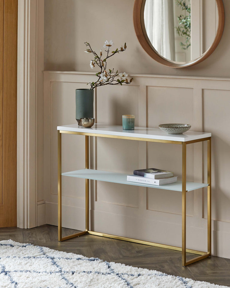 Elegant modern console table with a white tabletop and lower shelf, framed by a sleek gold-finish metal structure.