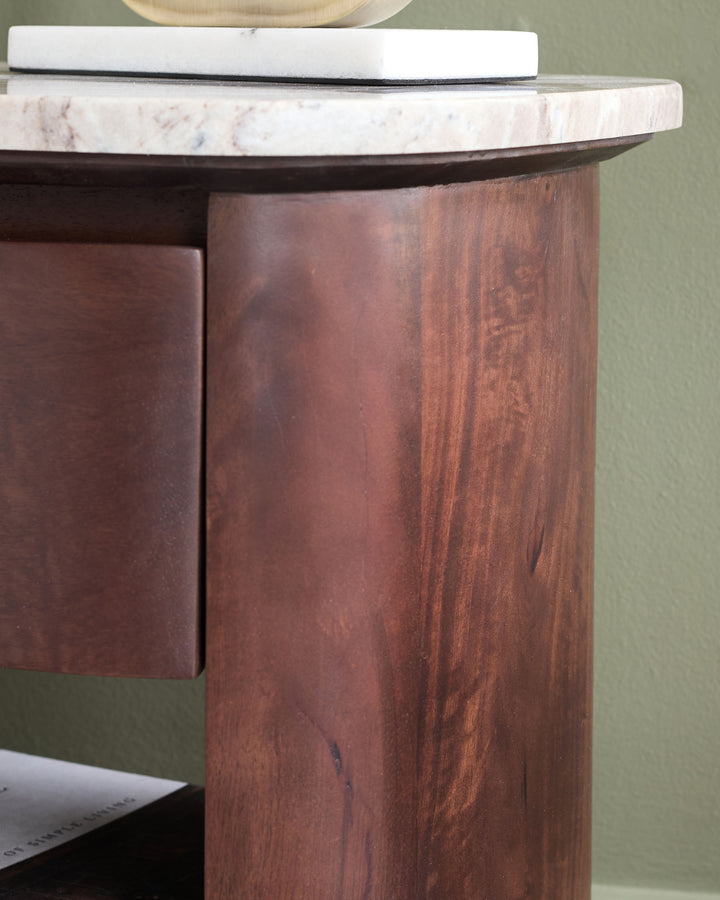 Adalynn bedside table with dark walnut wood base and white marble top, shown at side angle.