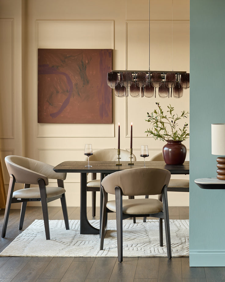 Amelia dining chair in natural leather with mocha wood frame, shown in modern dining setting at table.