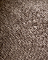 Close-up of mocha-colored textured fabric on Anya accent chair showing woven weave pattern and neutral tone.