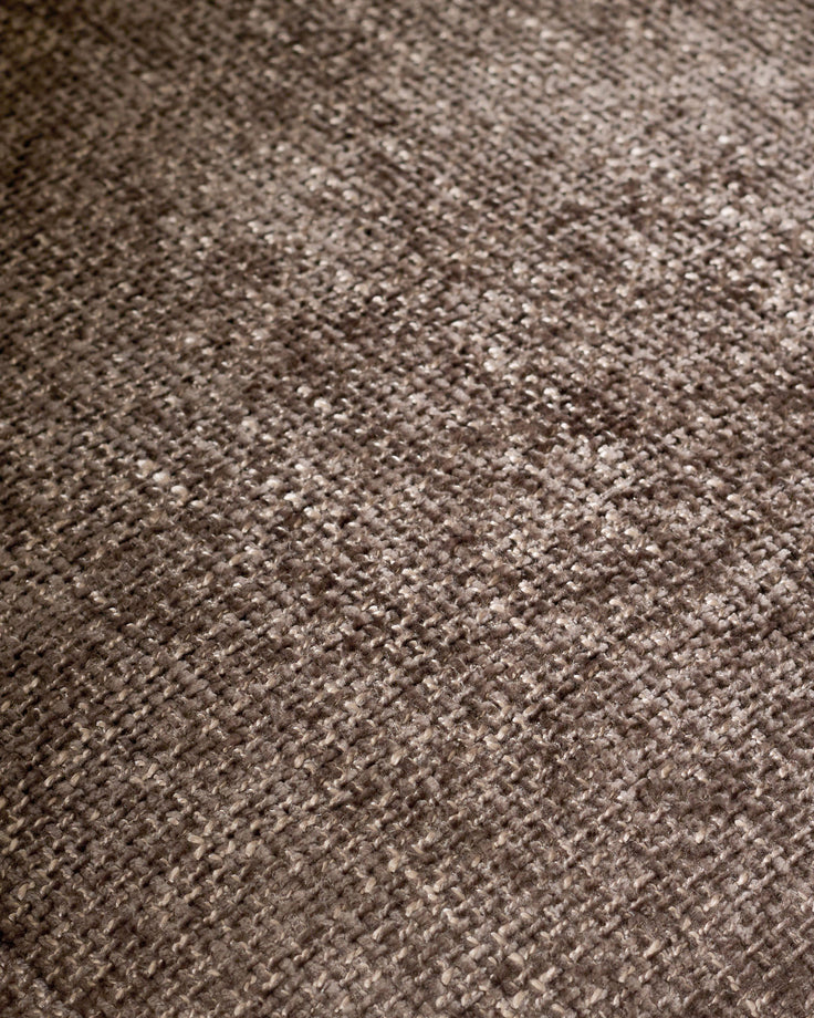 Close-up of mocha-colored textured fabric on Anya accent chair showing woven weave pattern and neutral tone.