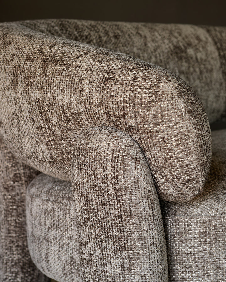 Anya accent sofa in mocha fabric, close-up detail showing textured weave and rolled armrest design.