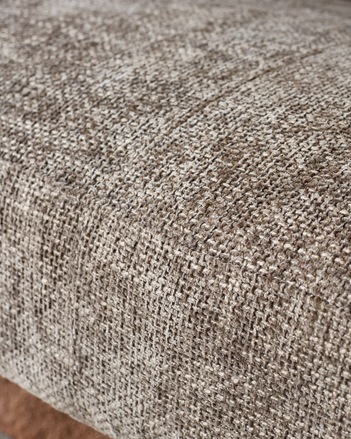 Close-up of Anya accent sofa fabric in mocha, showing textured woven material with neutral tone.