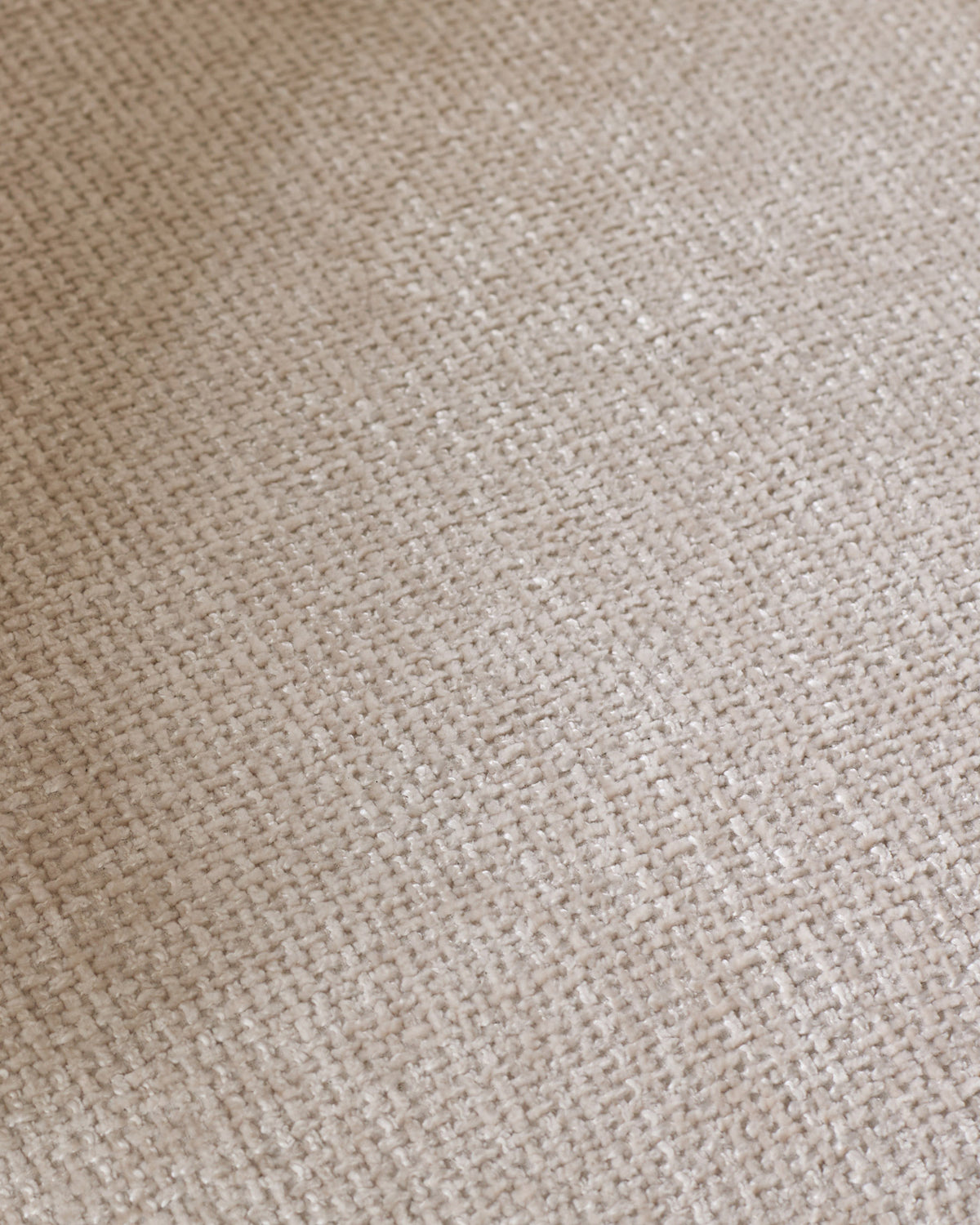 Close-up of natural beige woven fabric texture on Anya accent chair, showing neutral weave pattern and soft finish.