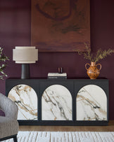 Archie Large Sideboard in black with three marble-fronted doors, displayed in a styled living room setting.