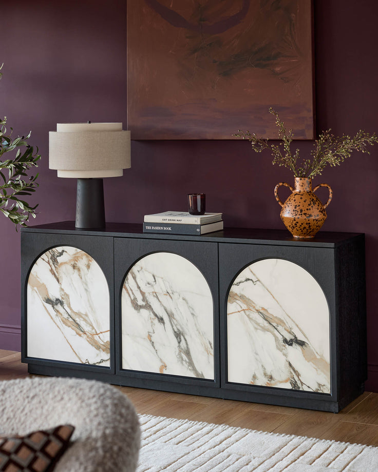 Archie large sideboard in charcoal with three arched marble-effect ceramic door fronts, styled in a modern living room setting.
