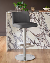 Arlo dark grey leather gas lift bar stool with brushed metal base, positioned at marble-effect kitchen island.