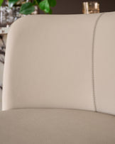 Close-up of light grey leather upholstery on Arlo bar stool, showing textured surface and stitched seam detail.