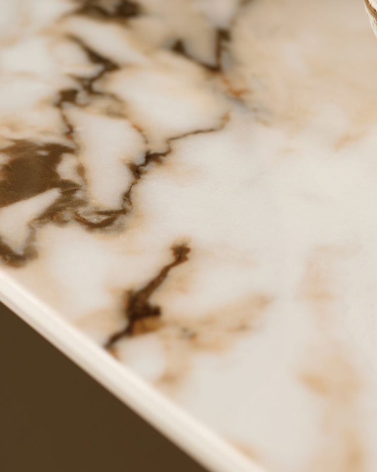 Austin console table in natural ceramic with brown veining detail, close-up of surface texture.