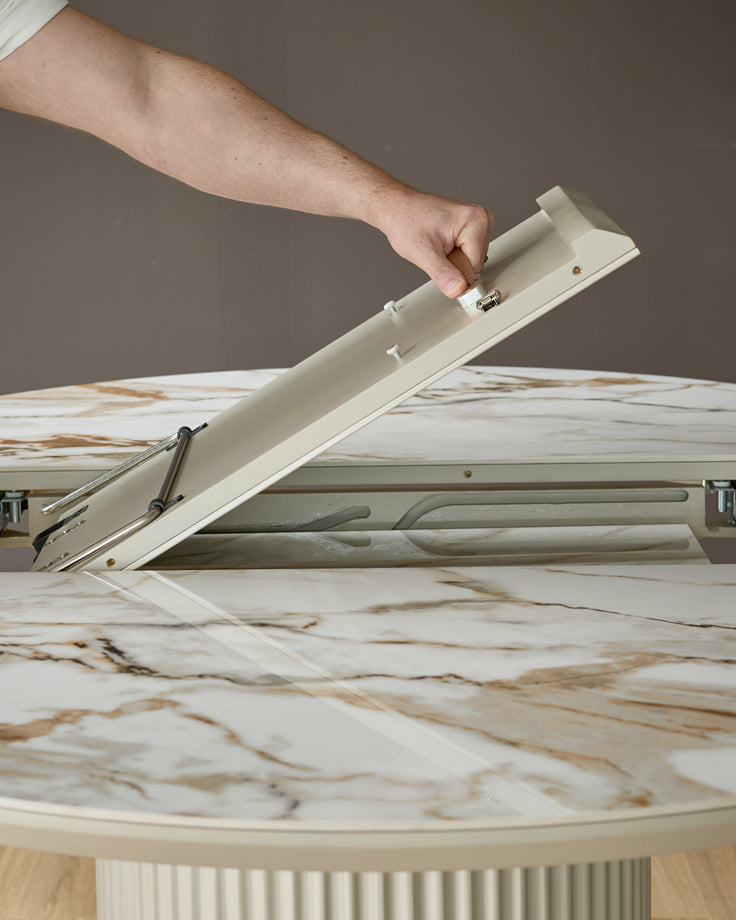 Hand opening extending mechanism on natural ceramic dining table with wood grain pattern top