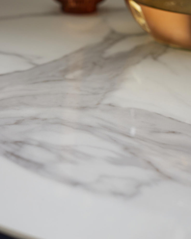 Marble countertop with copper bowls, close-up. A luxurious addition to any kitchen or dining area.