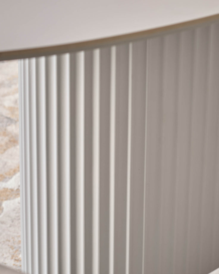 Austin ceramic fluted dining table in white, close-up of textured vertical ribbed surface detail.