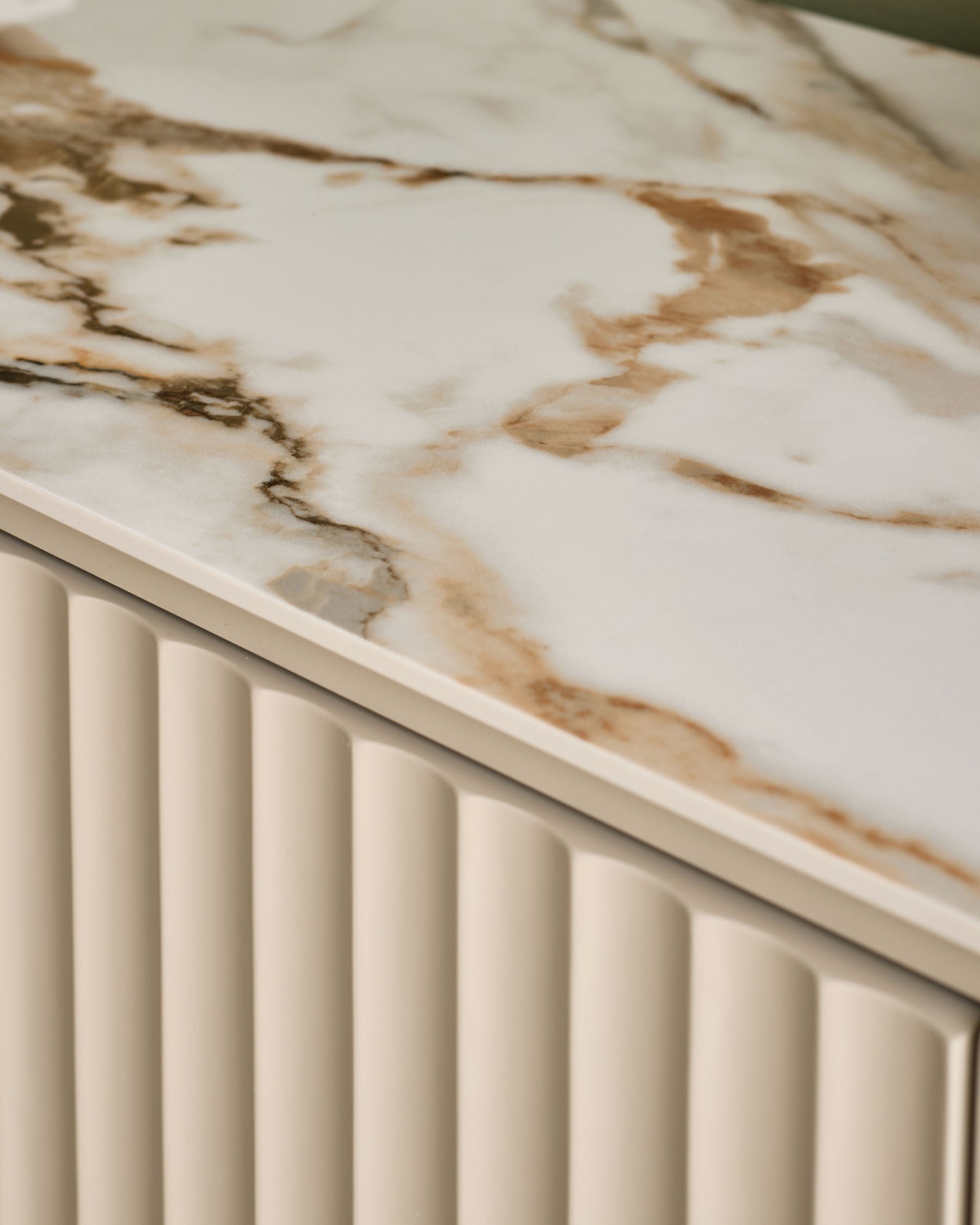 Austin compact sideboard with natural ceramic marble-effect top and cream fluted front panel detail.