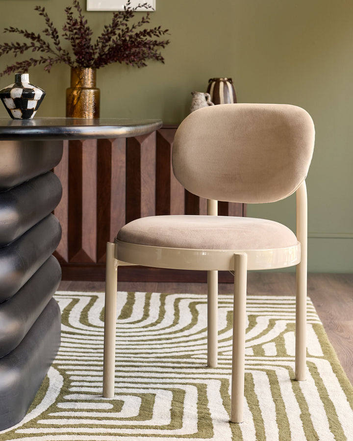 Blake dining chair in champagne velvet with cream wooden legs, shown in styled room setting.