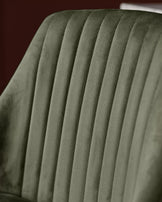 Blakely bar stool in olive green velvet with vertical channel stitching detail, close-up view.