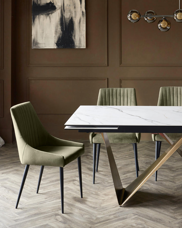 Blakely velvet dining chair in olive green with vertical stitching and black tapered legs, shown in dining setting.