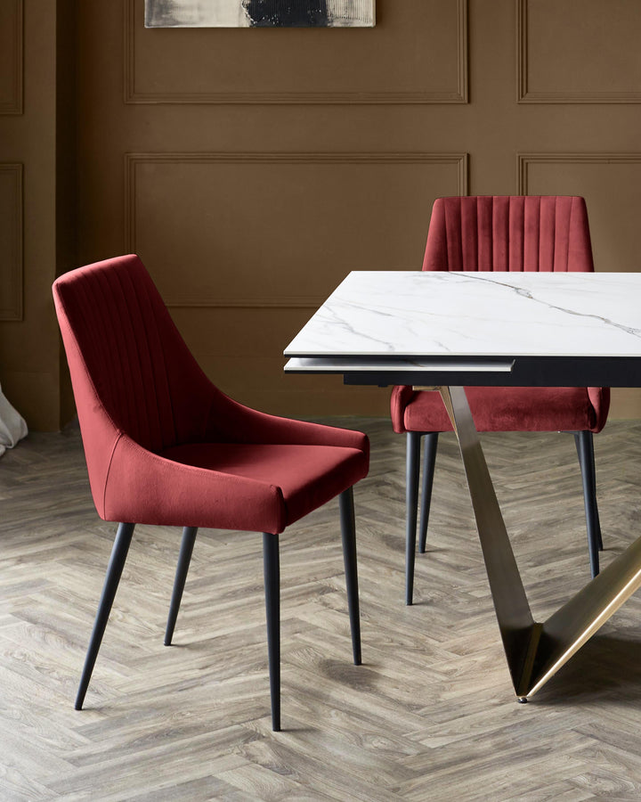 A modern marble-effect dining table with sleek red velvet chairs. Perfect for stylish dining.