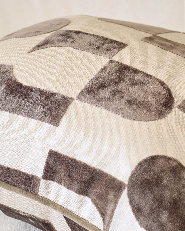Bridget cushion in medium size, chocolate brown and cream geometric pattern, close-up detail view.