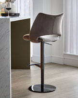 Bronwyn gas lift bar stool in mocha and natural velvet with black metal base, shown in modern interior setting.