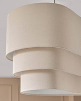 Burleigh 2-bulb pendant light in natural linen with stacked cylindrical shades and open bottom design.
