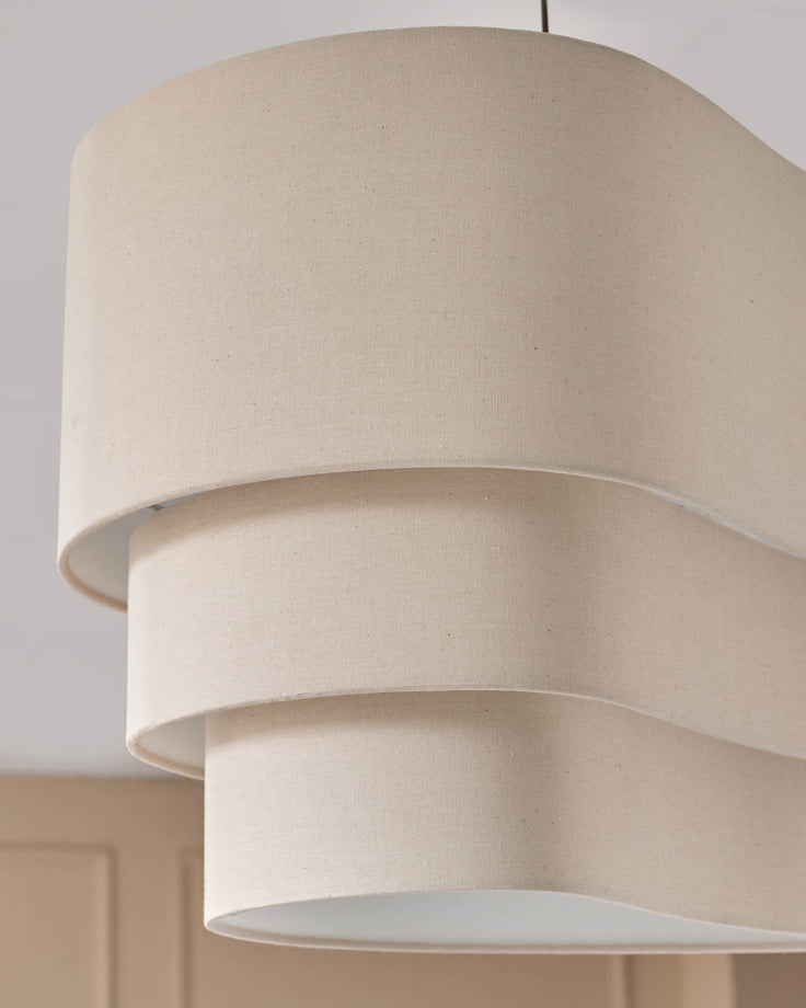 Burleigh 2-bulb pendant light in natural linen with stacked cylindrical shades and open bottom design.