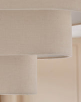 Burleigh 2-bulb pendant light with natural linen shades, close-up detail of cylindrical fabric texture.