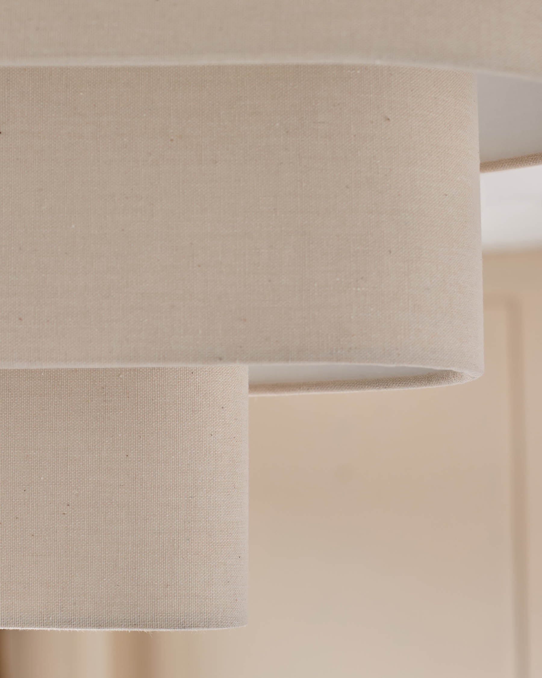 Burleigh 2-bulb pendant light with natural linen shades, close-up detail of cylindrical fabric texture.
