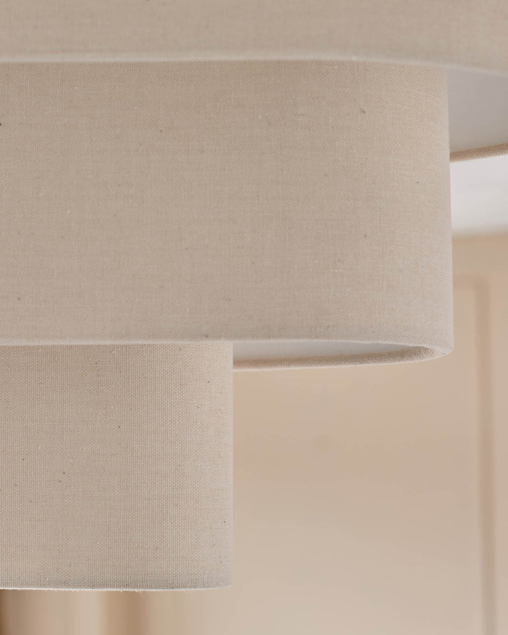 Burleigh 2-bulb pendant light with natural linen shades, close-up detail of cylindrical fabric texture.