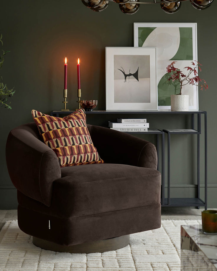 A stylishly curated living space with a brown swivel chair, dark metal shelving unit, framed art and soft cream rug.