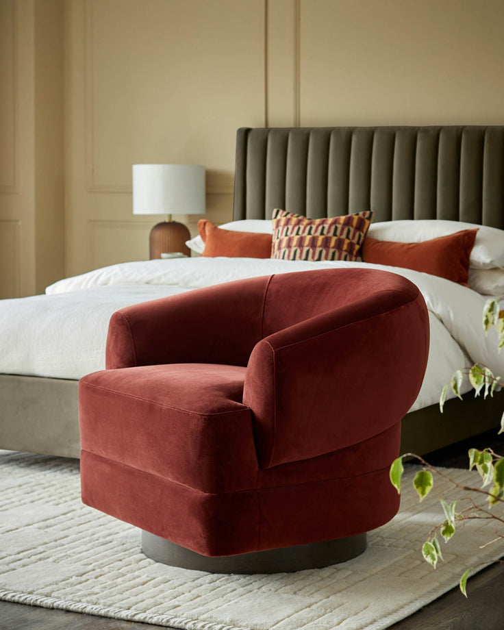 Luxurious velvet swivel chair in a bedroom setting. A stylish and comfy addition to any home.