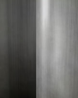 Close-up of brushed metal handle on Carlo 8-seater dining table with dark grey ceramic top