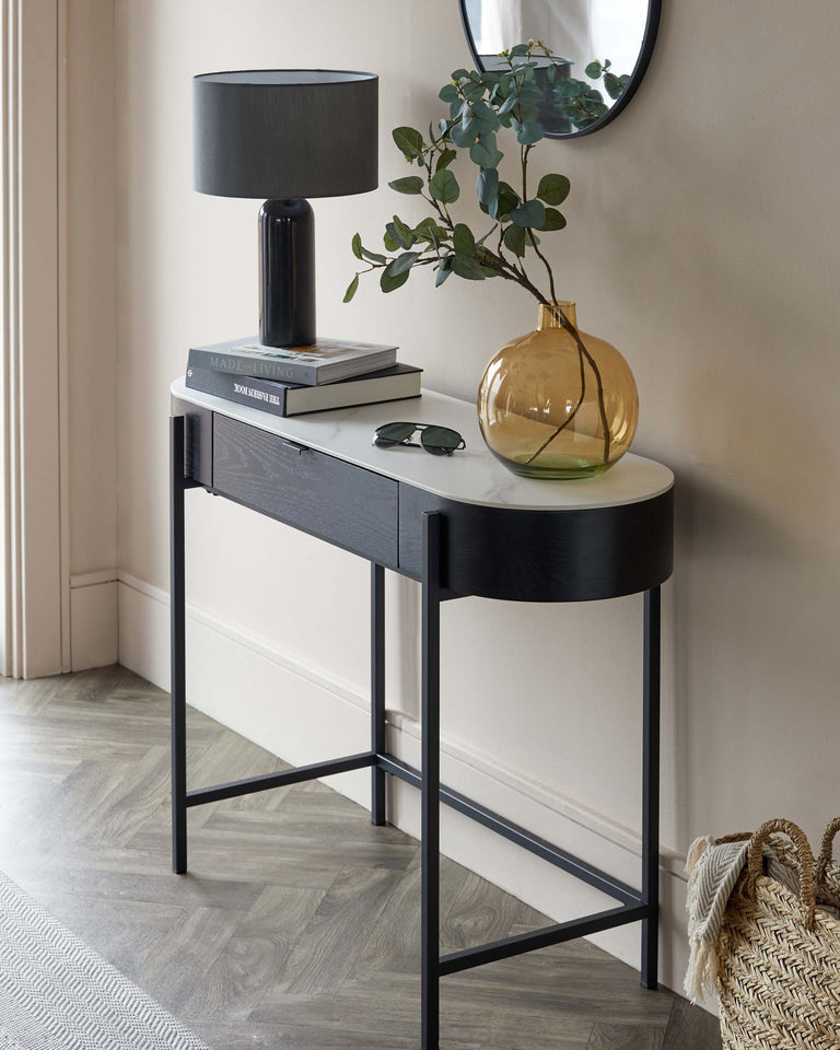 Elegant modern console table with a sleek black finish, featuring a smooth rectangular top and a sturdy metal frame with straight legs.