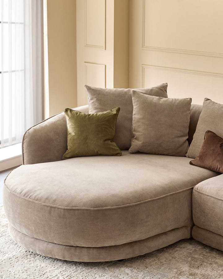 Caspian left-hand corner chaise sofa in mink fabric with coordinating cushions in a bright, neutral room.
