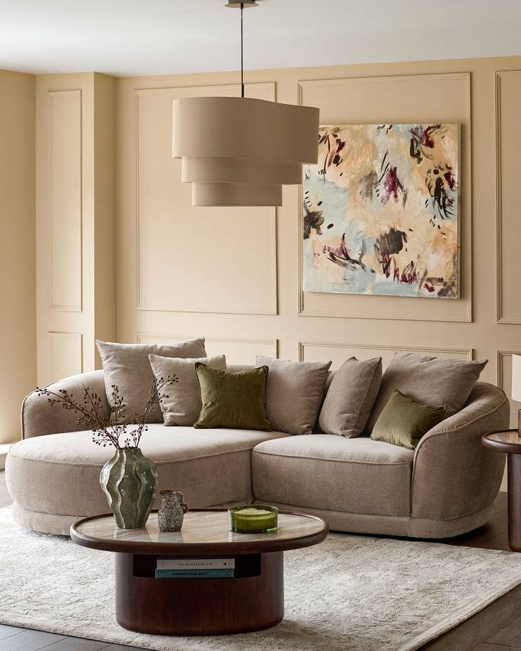 Caspian left-hand corner chaise sofa in mink fabric, styled in a neutral living room with coordinating cushions and pendant lighting.
