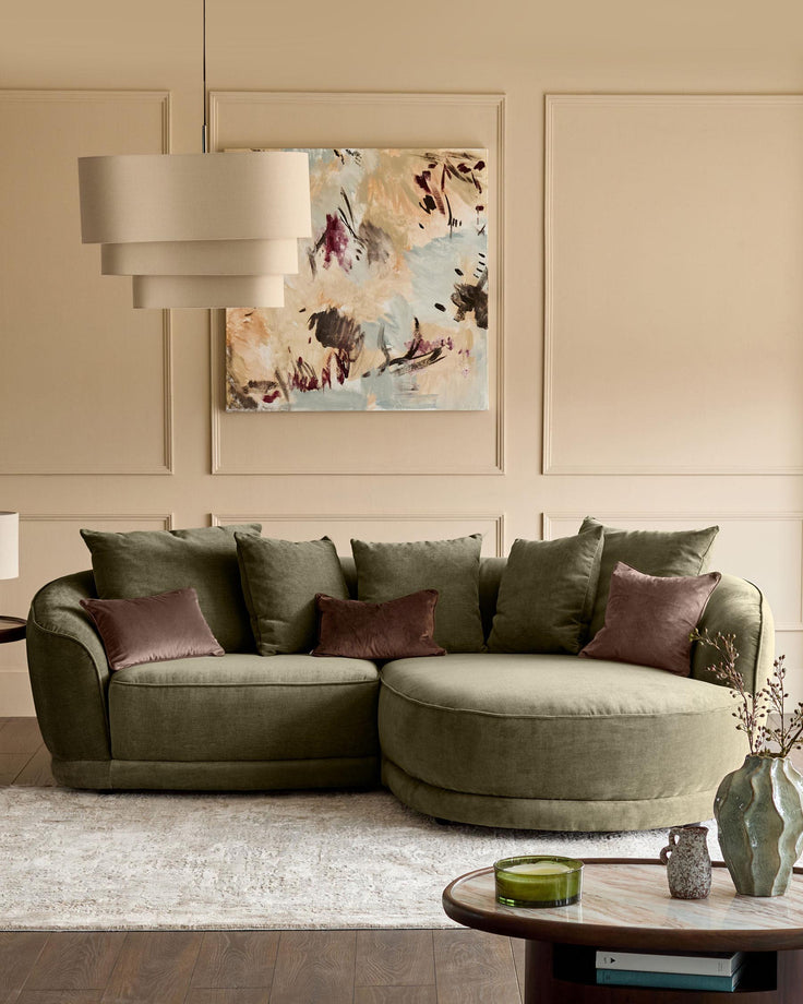 Caspian right-hand corner chaise sofa in olive green fabric, styled with burgundy and green cushions in a modern living room.