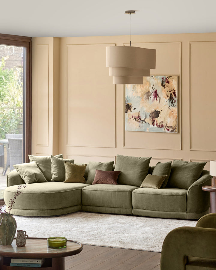 Caspian single module fabric sofa in olive green, curved design with rounded armrests in modern living room setting.